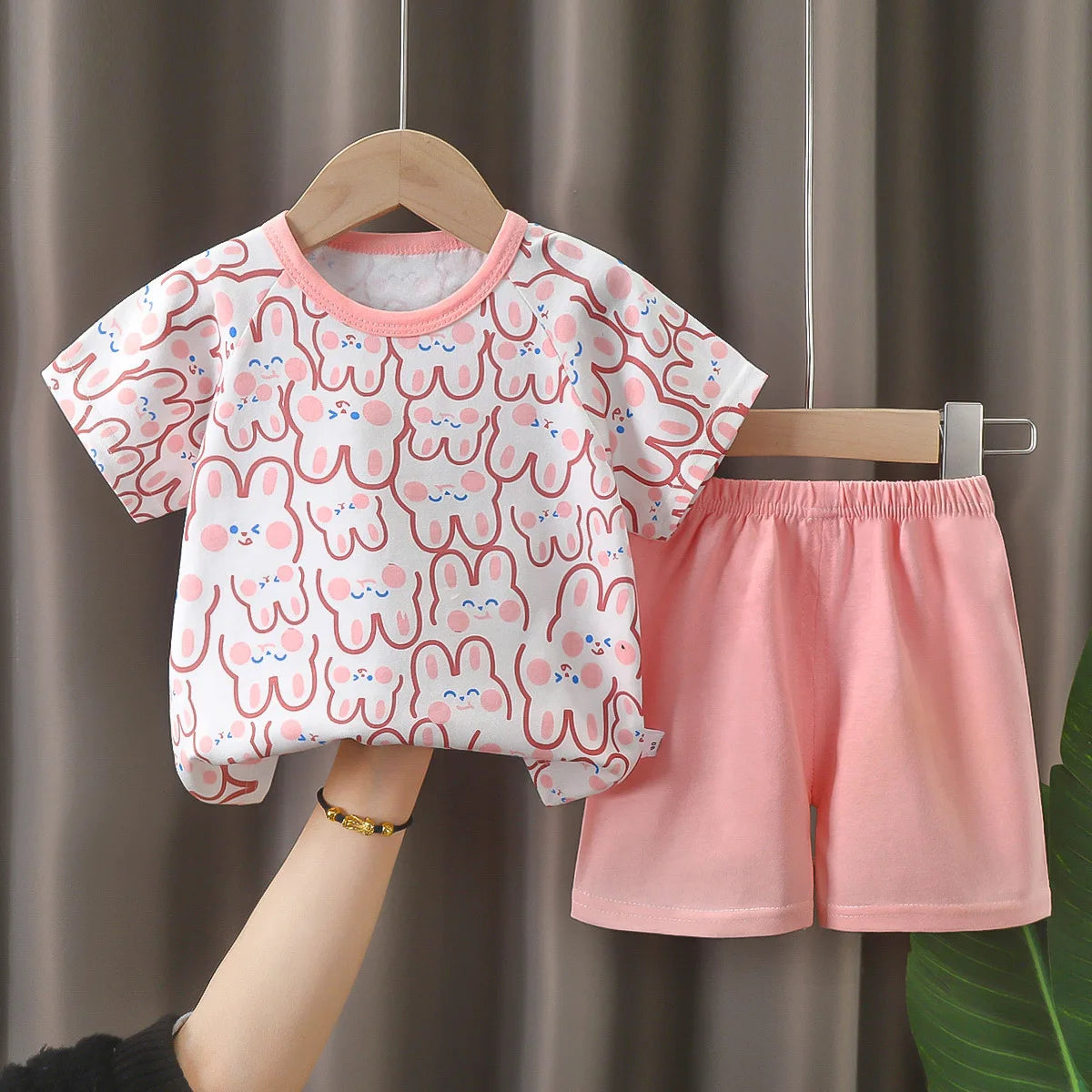 A soft and breathable baby girl pajama set, perfect for newborns and toddlers up to 3 years old 7