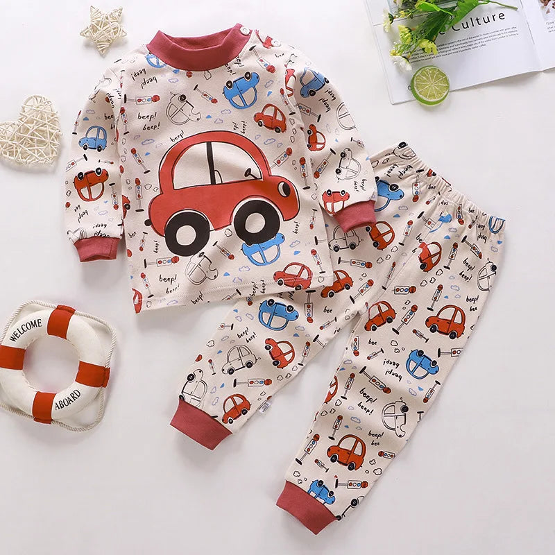 A baby girl's outfit set with long sleeves, featuring Minnie Mouse character designs, hanging on a wooden hanger.