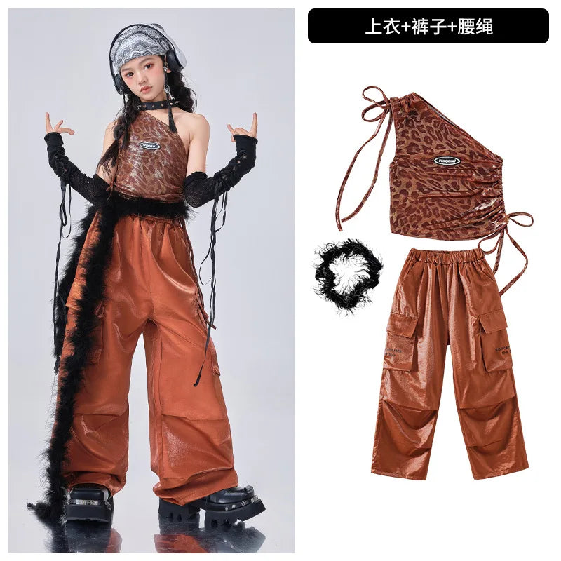 Brown outfit with leopard print top and pants, including accessories, on a white background.