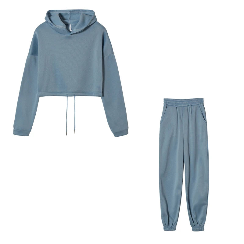 Women’s fashion two-piece sportswear set with long sleeves and high-waist casual pants in neutral tones blue