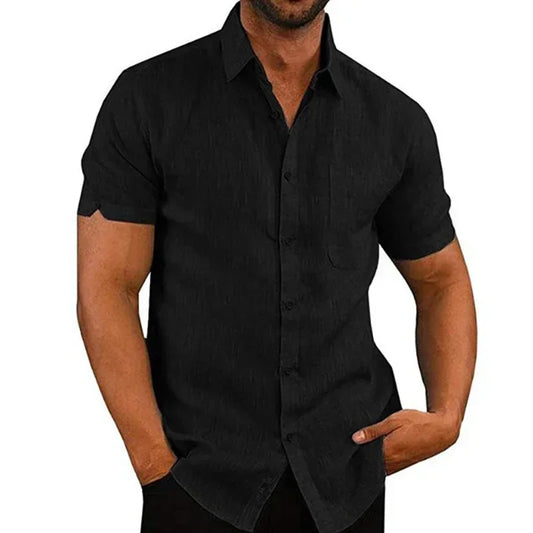 Man wearing a black short-sleeve button-up shirt on a white background