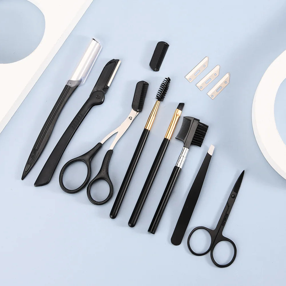 Set of black and gold grooming tools on a light blue background