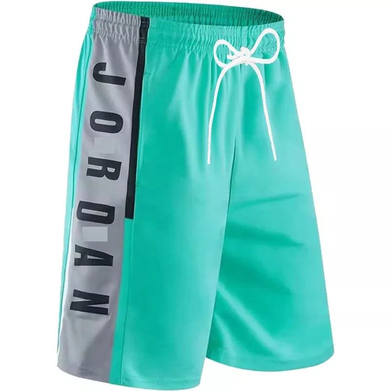Teal shorts with 'Jordan' branding on a white background