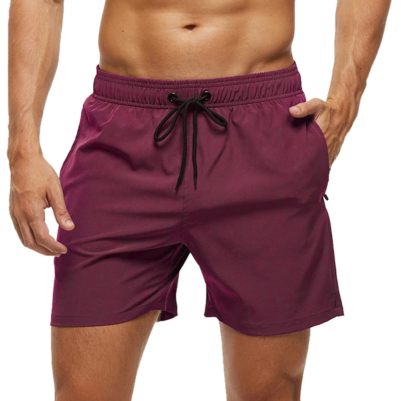 Purple shorts with a drawstring on a white background