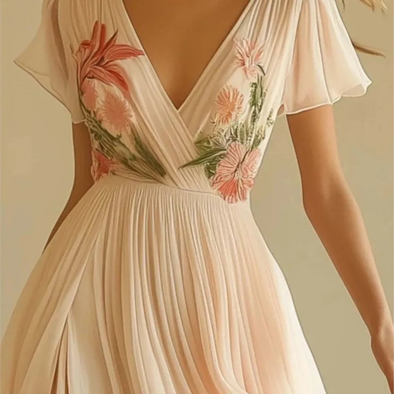 Beige dress with floral embroidery on a neutral background