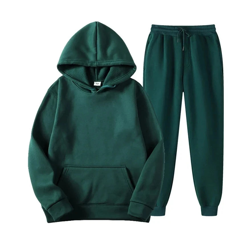 Green hoodie and pants set on a white background