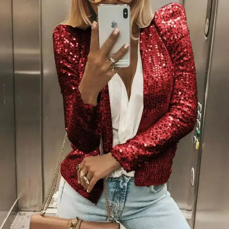 Person wearing a red sequin jacket in an elevator