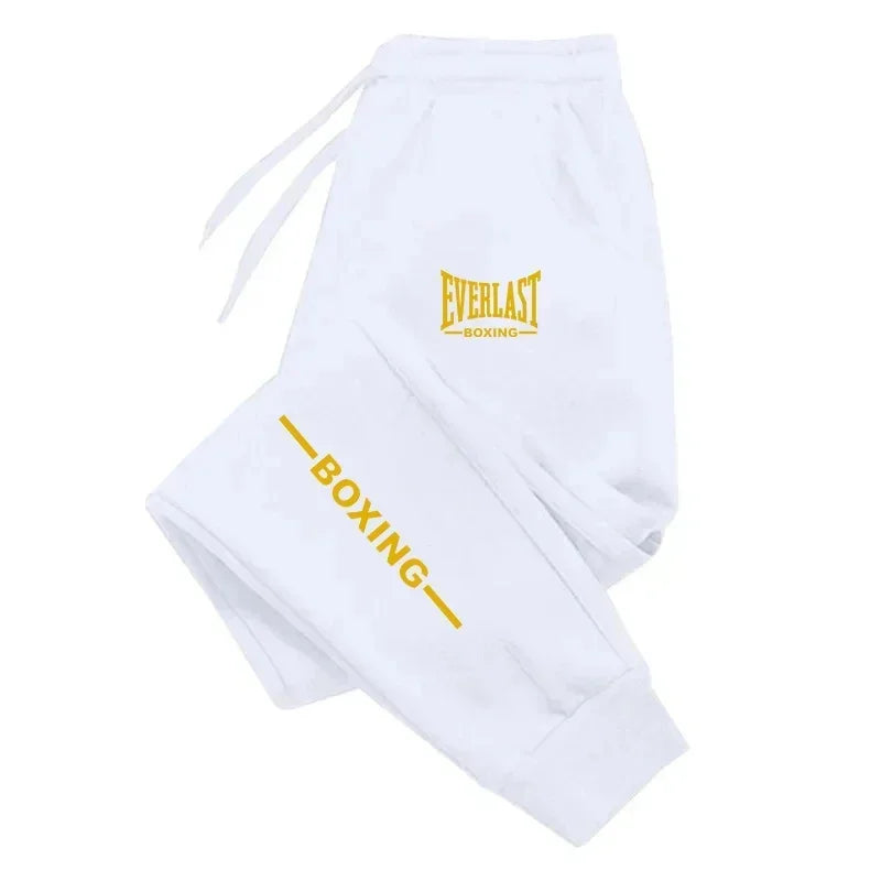 White boxing shorts with yellow 'Everlast Boxing' logo on a white background