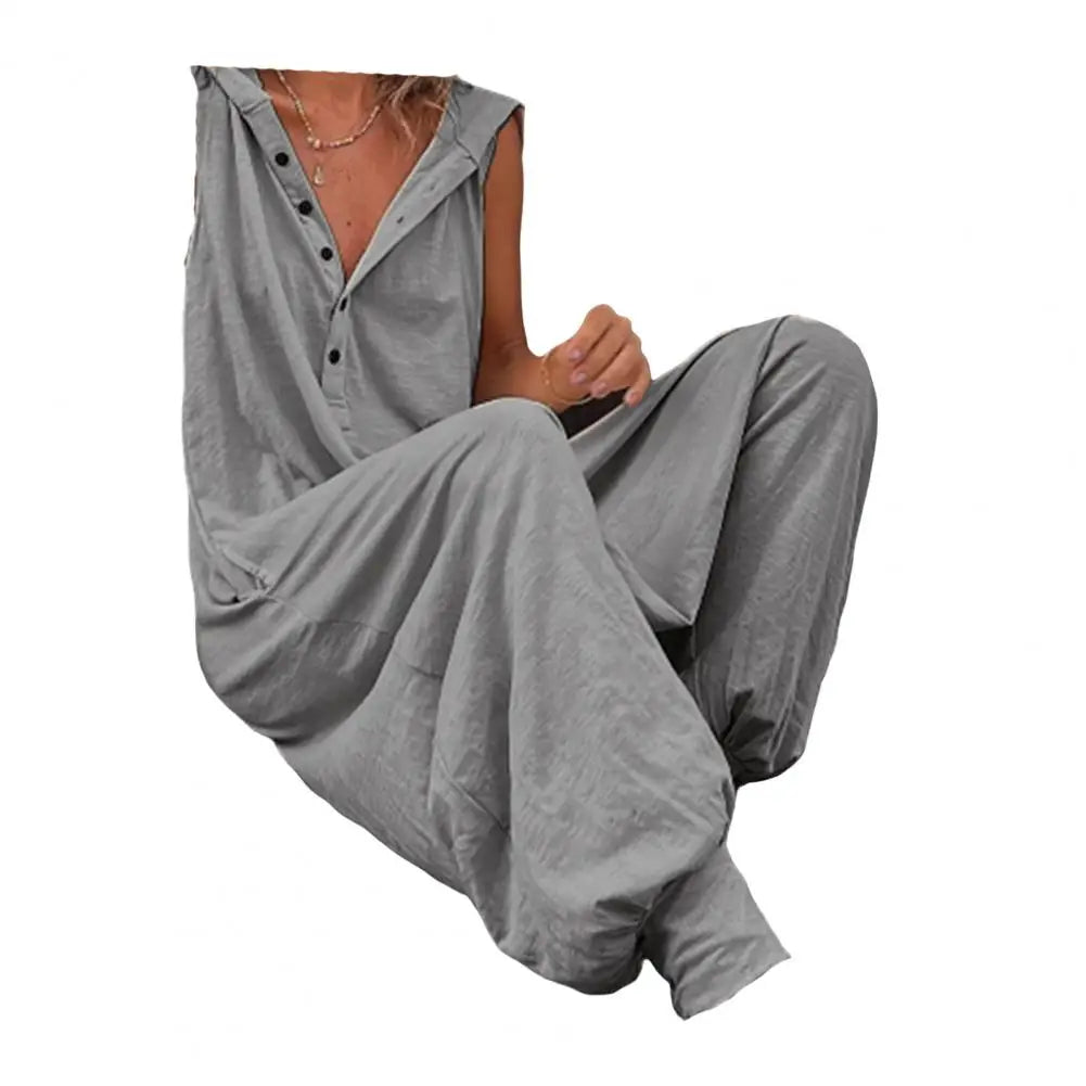 Person wearing a gray button-up shirt and pants on a white background