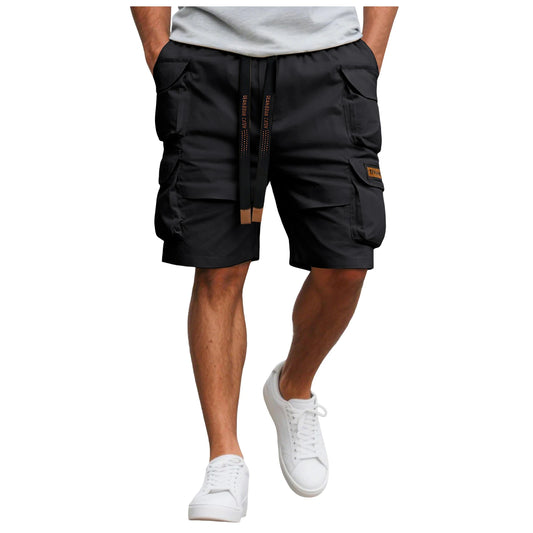 Black cargo shorts worn by a person on a white background