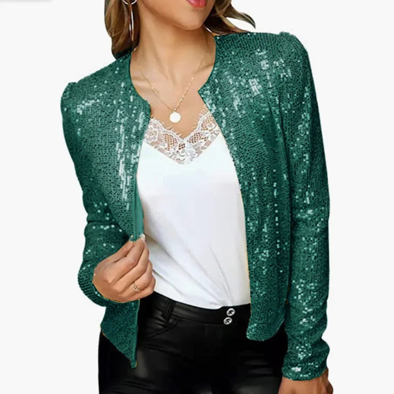 Green sequin cardigan over a white top on a white background