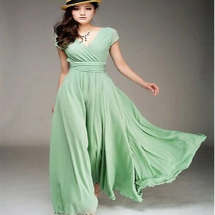 Woman wearing a light green dress against a plain background