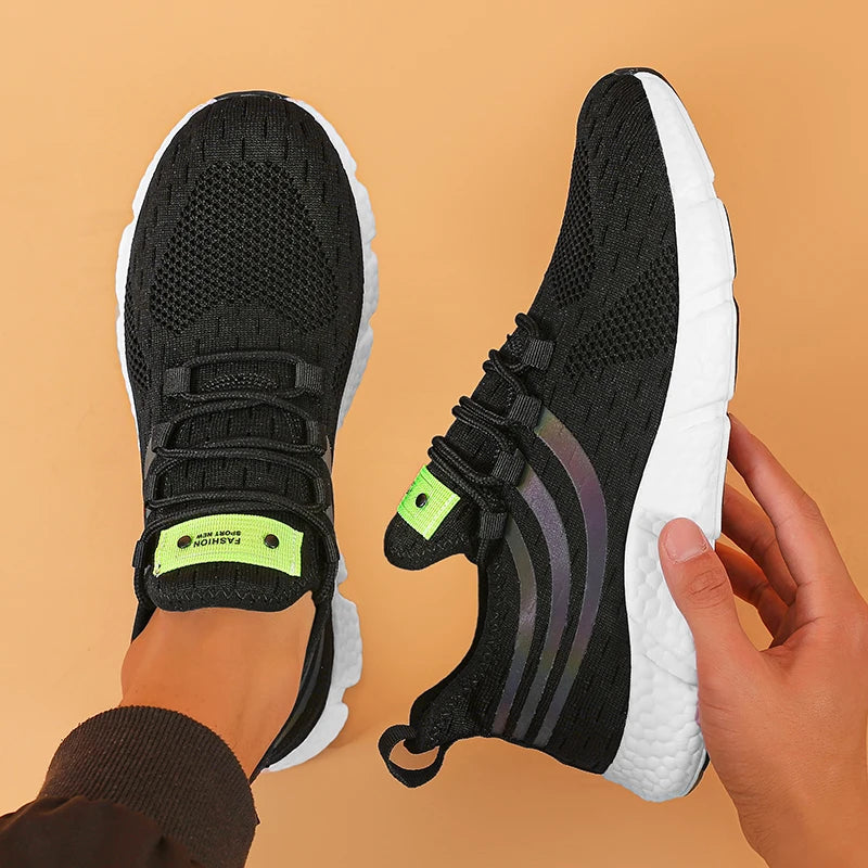 sneakers designed with breathable mesh and cushioned soles for all-day comfort in sports and casual wear. black
