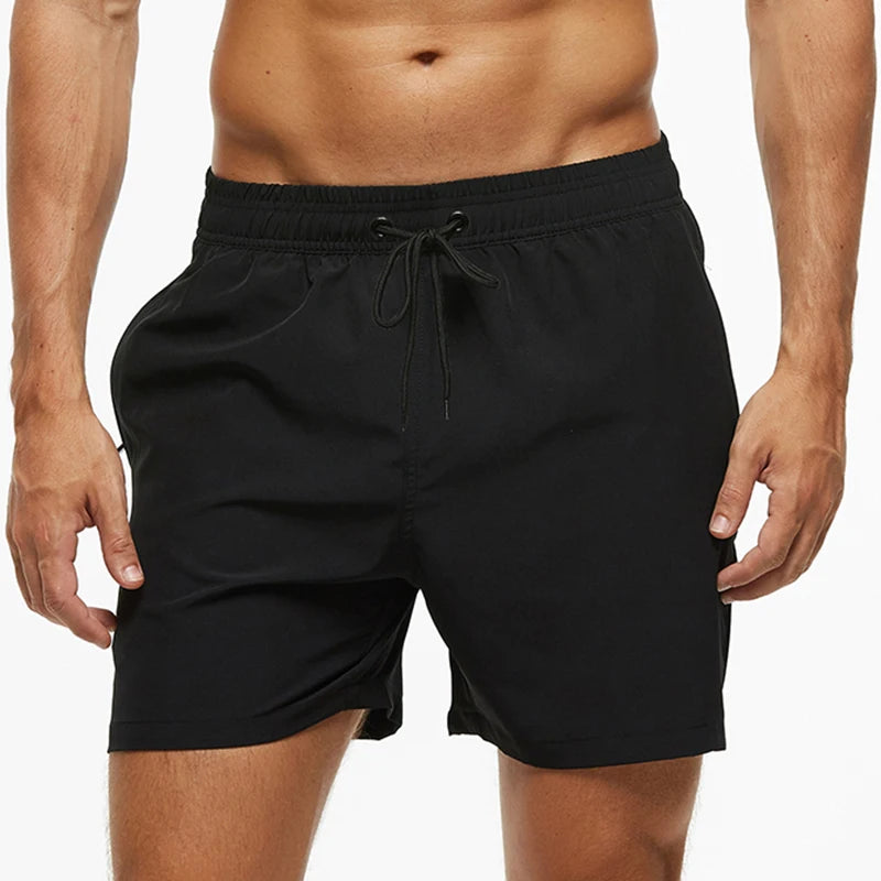 Black shorts worn by a person on a white background