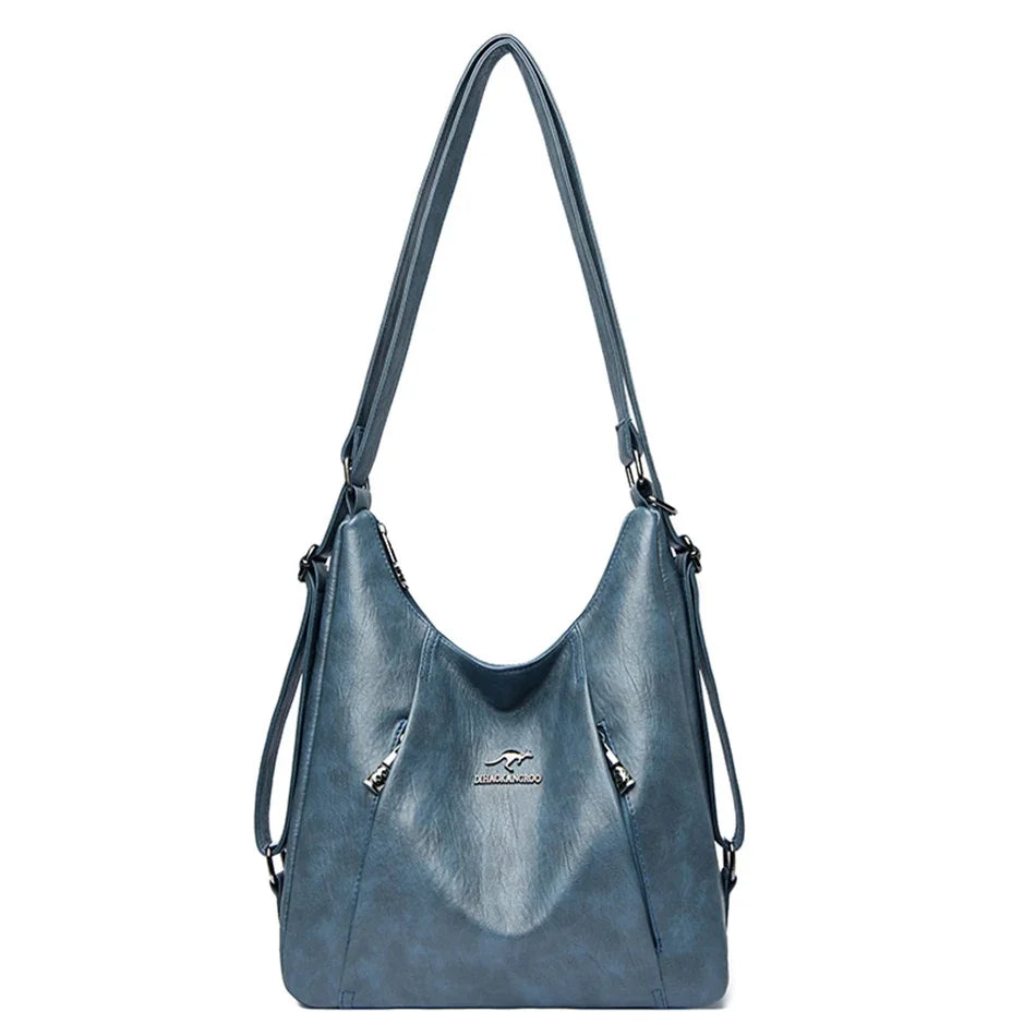 Blue handbag with a visible brand logo on a white background