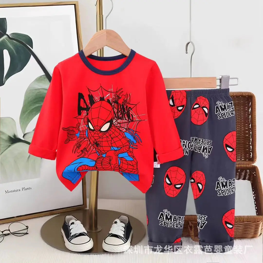 Children's Spider-Man pajama set with red shirt and navy pants on a hanger.