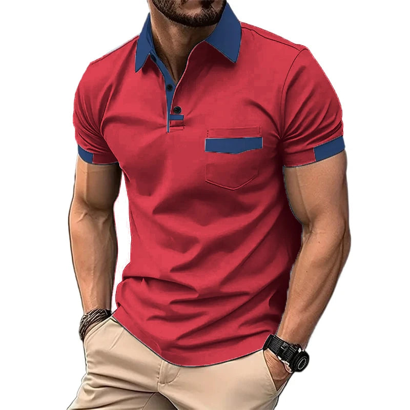A man wearing a short-sleeved beige polo shirt with blue collar and pocket trim, and light beige shorts.