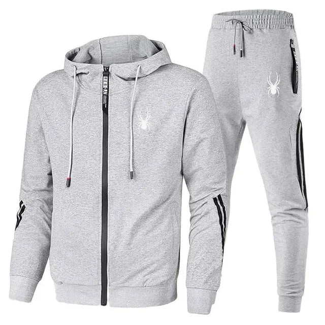 Gray tracksuit with hood and jogger pants on a white background