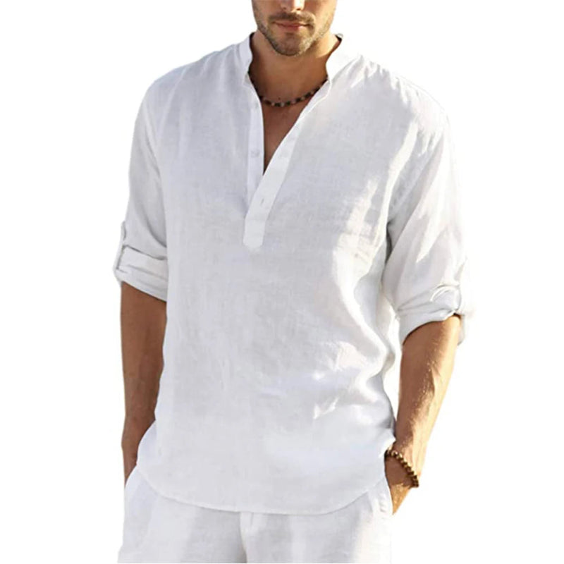 Man wearing a white shirt with rolled-up sleeves on a white background