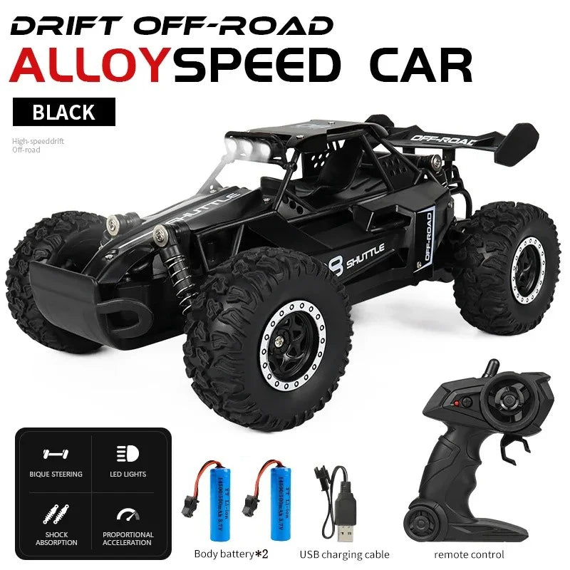 Black alloy speed car with remote control and accessories on a white background