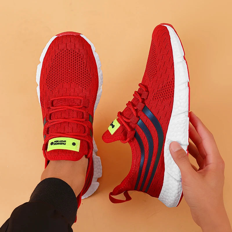 sneakers designed with breathable mesh and cushioned soles for all-day comfort in sports and casual wear. red
