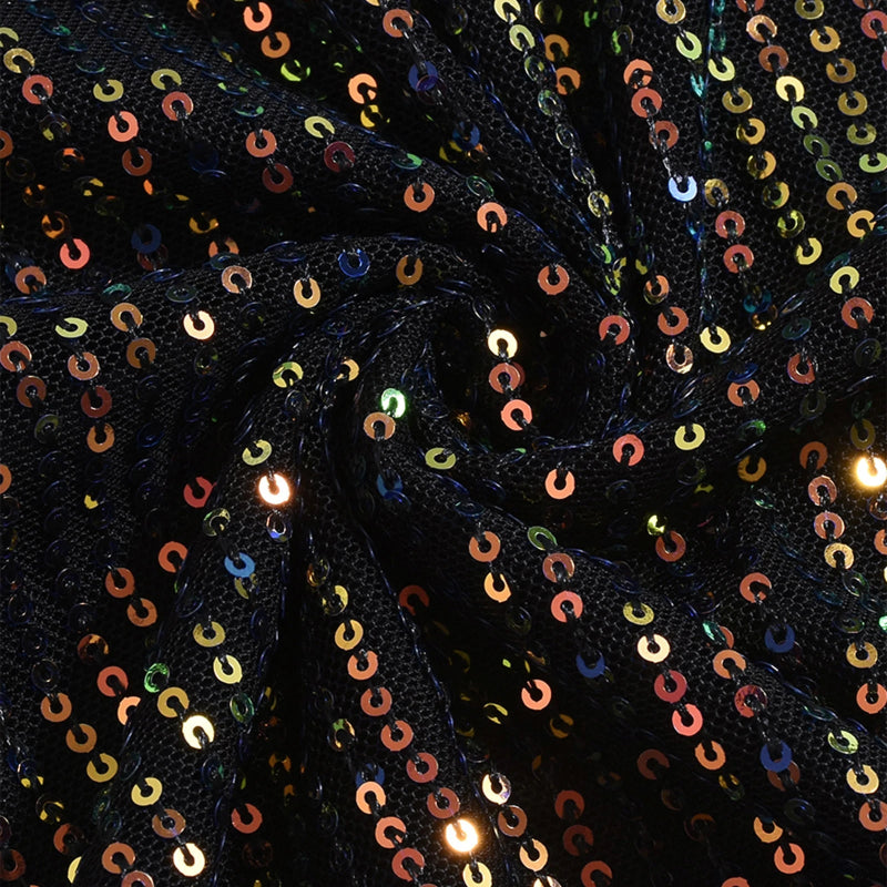 Close-up of black sequin fabric with multicolored sequins.
