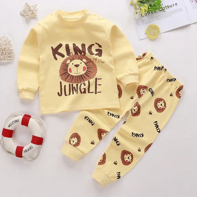A baby girl's outfit set with long sleeves, featuring Minnie Mouse character designs, hanging on a wooden hanger.