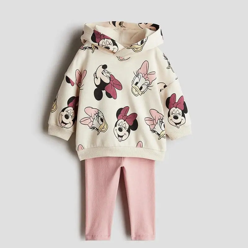 Children's hoodie with cartoon character prints and pink pants on a light gray background