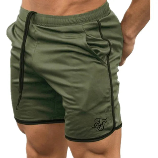 Green shorts with black piping on a white background