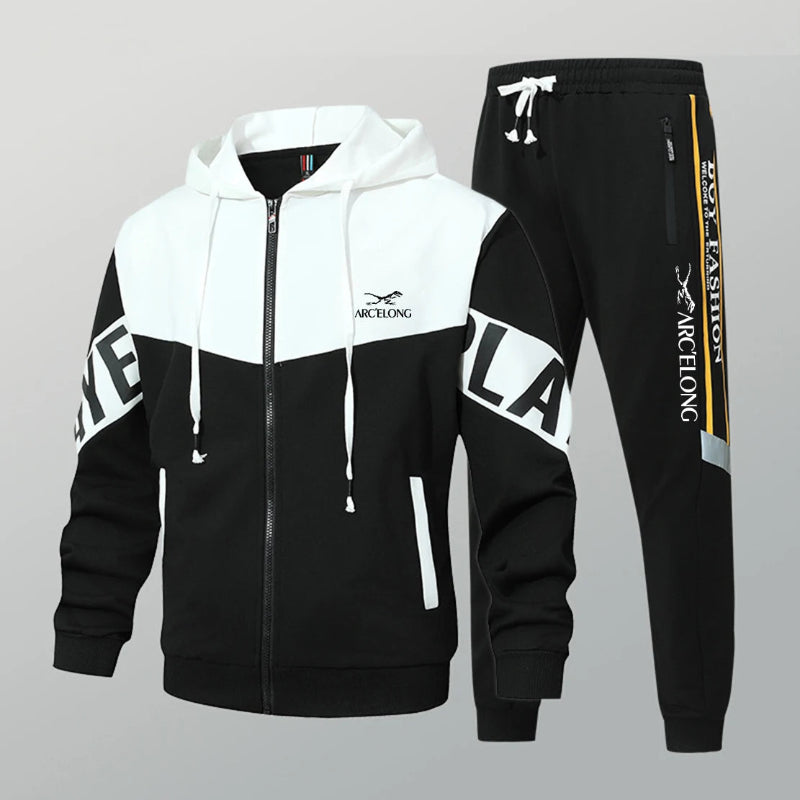 Black and white tracksuit with brand logo on a gray background