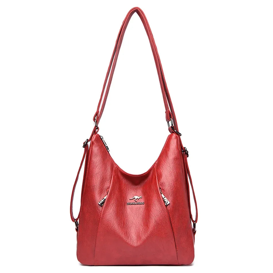 Red handbag with a visible brand logo on a white background