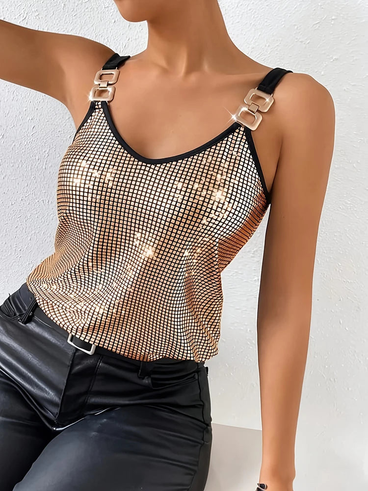 Person wearing a mesh tank top with gold accents on a white background