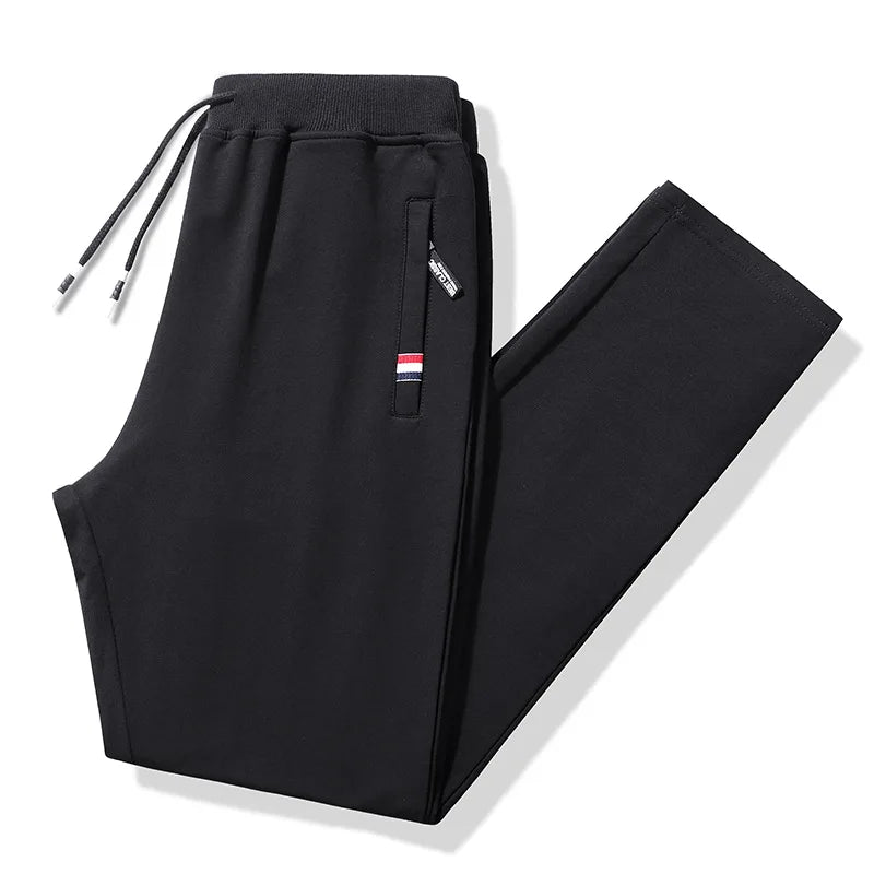 Black pants with a small logo on a white background