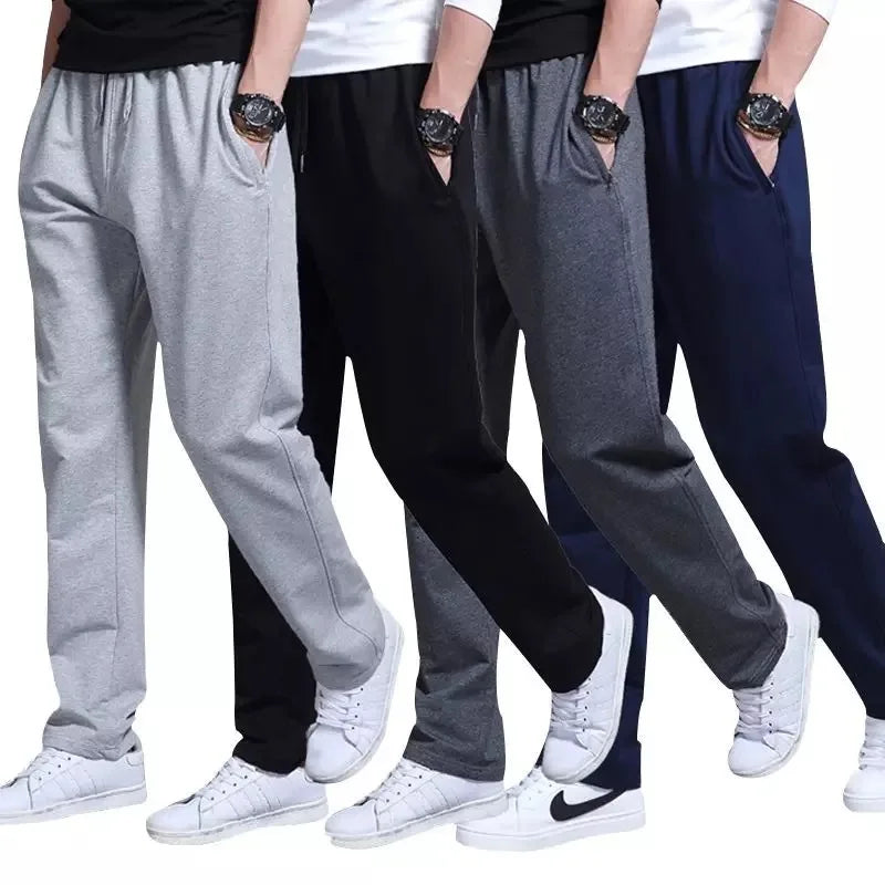 Four pairs of pants in gray, black, and blue worn by people on a white background.