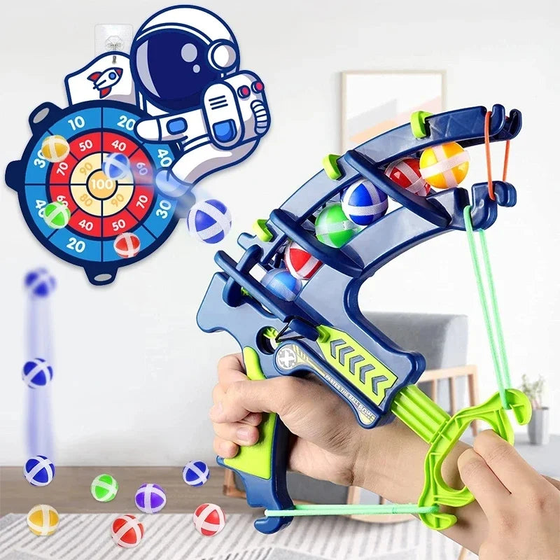 Toy archery set with colorful bows and arrows, held by a hand, against a white background.
