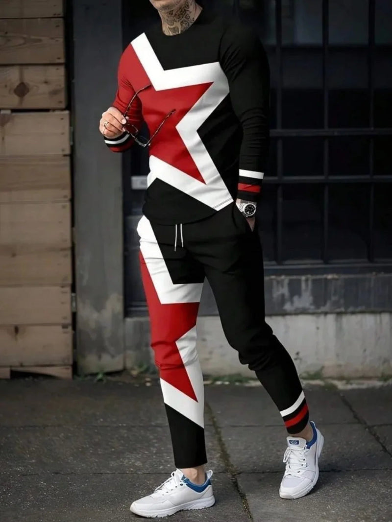 Person wearing a black, red, and white outfit with geometric design outdoors.