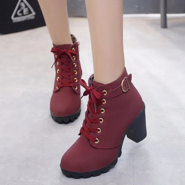Close-up of lace-up detail on high heel pumps boots- 1