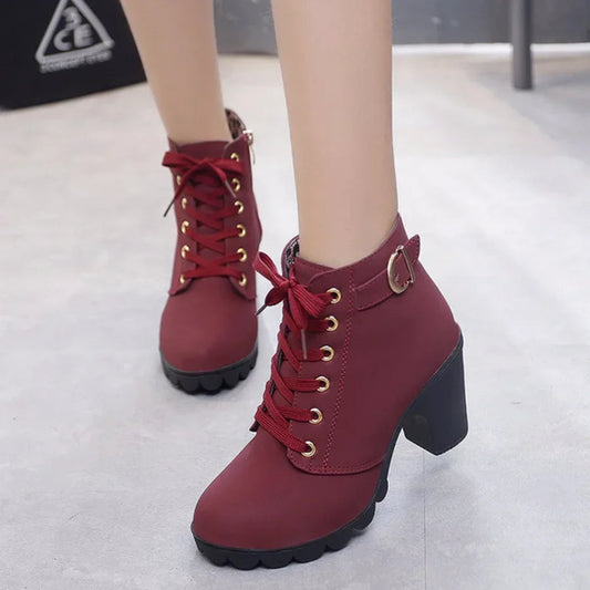Close-up of lace-up detail on high heel pumps boots- 1
