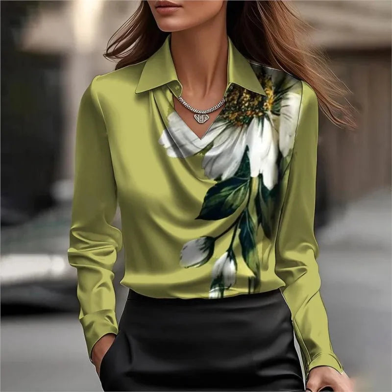 Woman wearing a green floral blouse with a blurred background