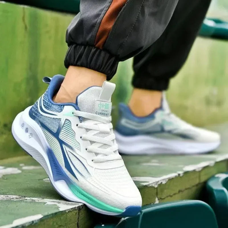 White and blue athletic shoe on a green surface