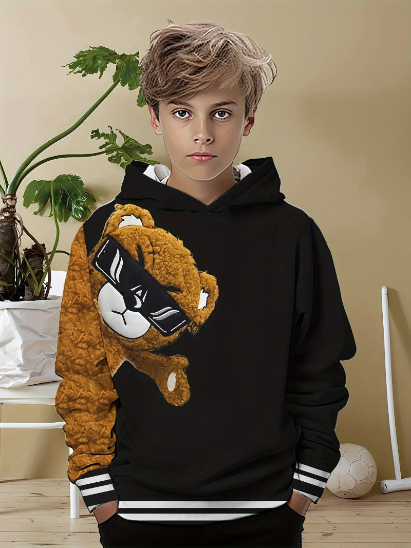 A boy wearing a black hoodie with a 3D print of a toy bear wearing sunglasses.