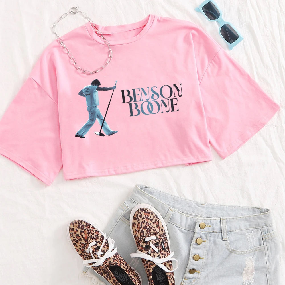 Pink t-shirt with 'Beyson Boone' graphic, leopard print shoes, denim shorts, and sunglasses on a white background