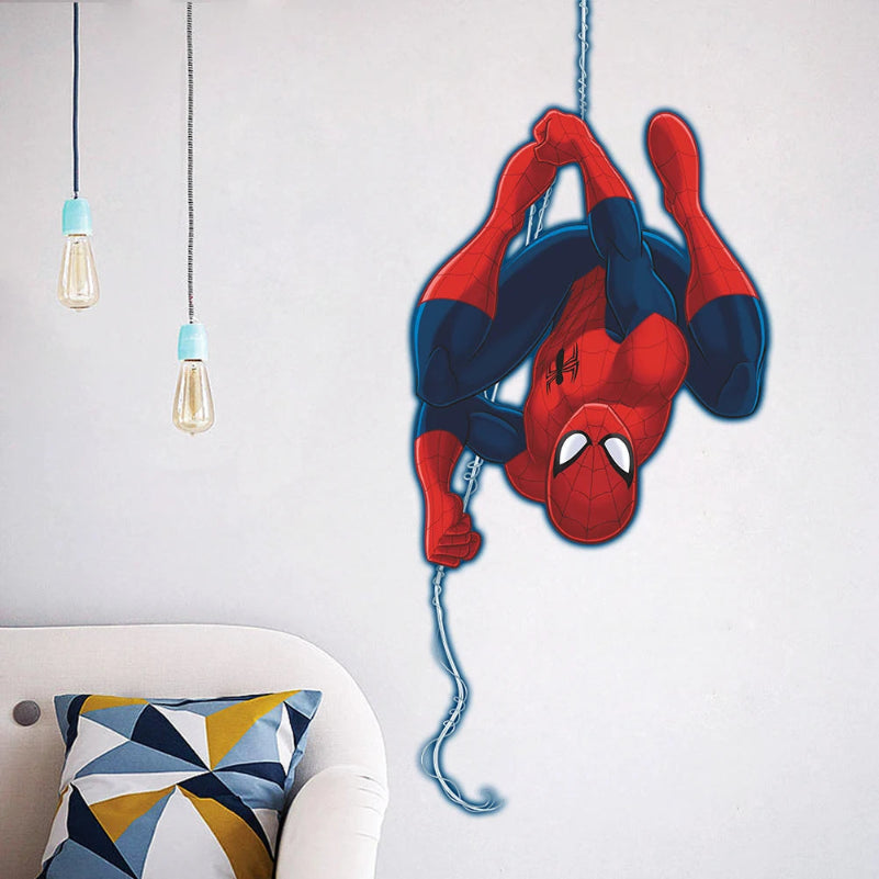 Spider-Man wall decal on a white wall with geometric pillow and light fixtures.