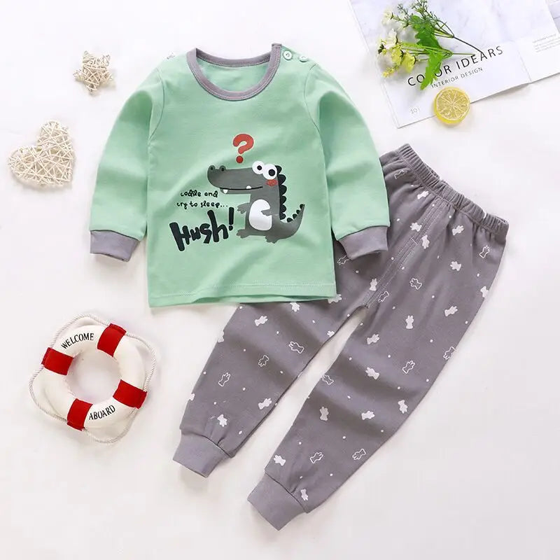 A baby girl's outfit set with long sleeves, featuring Minnie Mouse character designs, hanging on a wooden hanger.