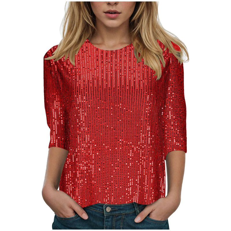 Red sequin top worn by a person on a white background