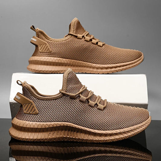 A pair of beige men's casual sneakers with a non-slip sole and lace-up closure.