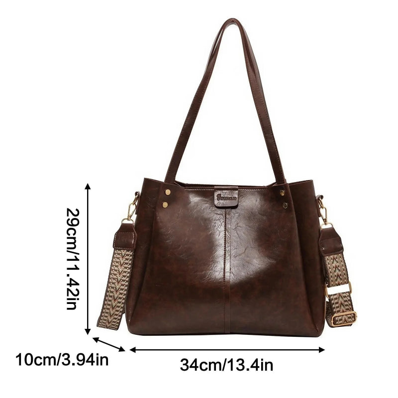 Brown handbag with measurements on a white background