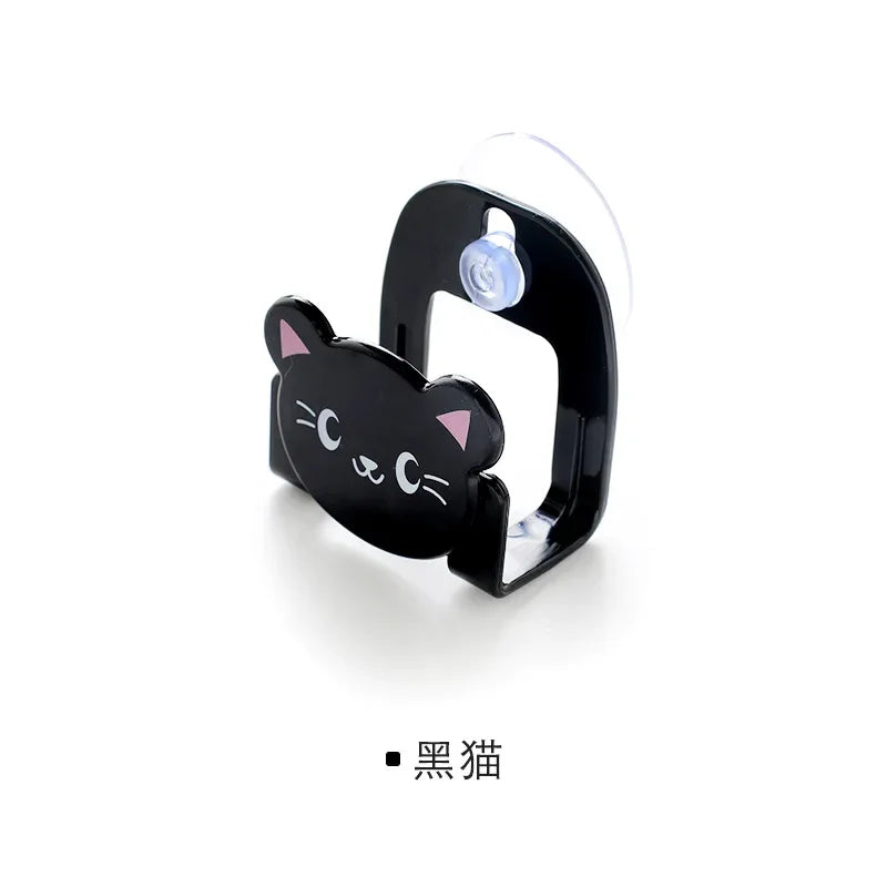 Black cat-shaped phone holder on a white background