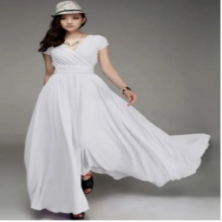 Woman wearing a white dress with a gray background