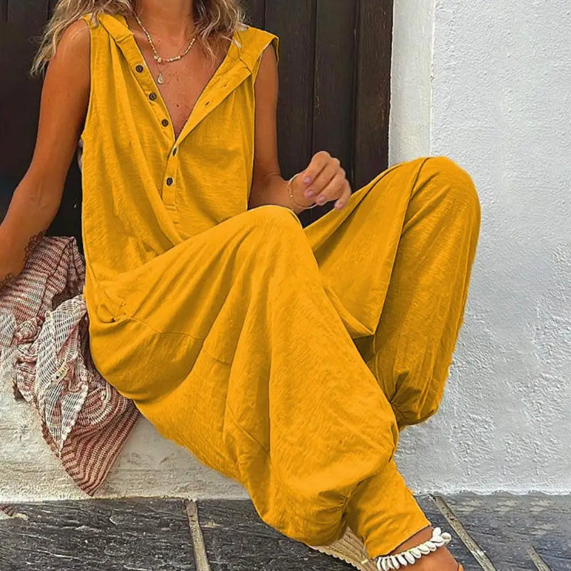 Person wearing a yellow outfit sitting on a step.